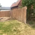 Wood fence panel with metal horizontal rail gate by All Woods Tree Service