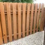 Close-up detail of stained wood fence boards installed by All Woods Tree Service in Utah