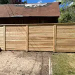 Cedar horizontal board fence installation by All Woods Tree Service, Utah cedar fence contractor