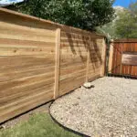 Cedar fence installation with mountain view background - All Woods Tree Service, Ogden Utah area